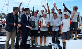 Line-honours-winning-crew-Miss-Scarlet-with-the-trophy_credit-Eye-Sky